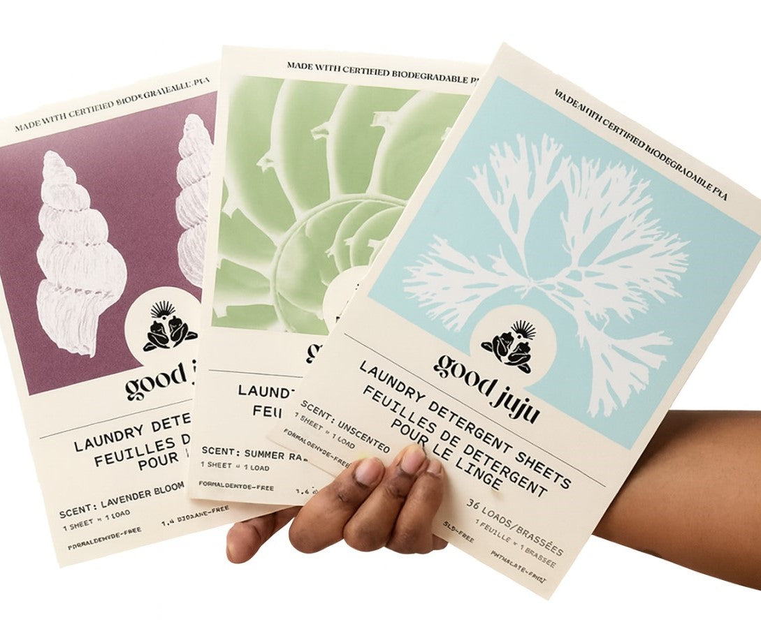 Good Juju biodegradable laundry detergent sheets in Lavender Bloom, Summer Rain, and Unscented, plastic-free eco strips.