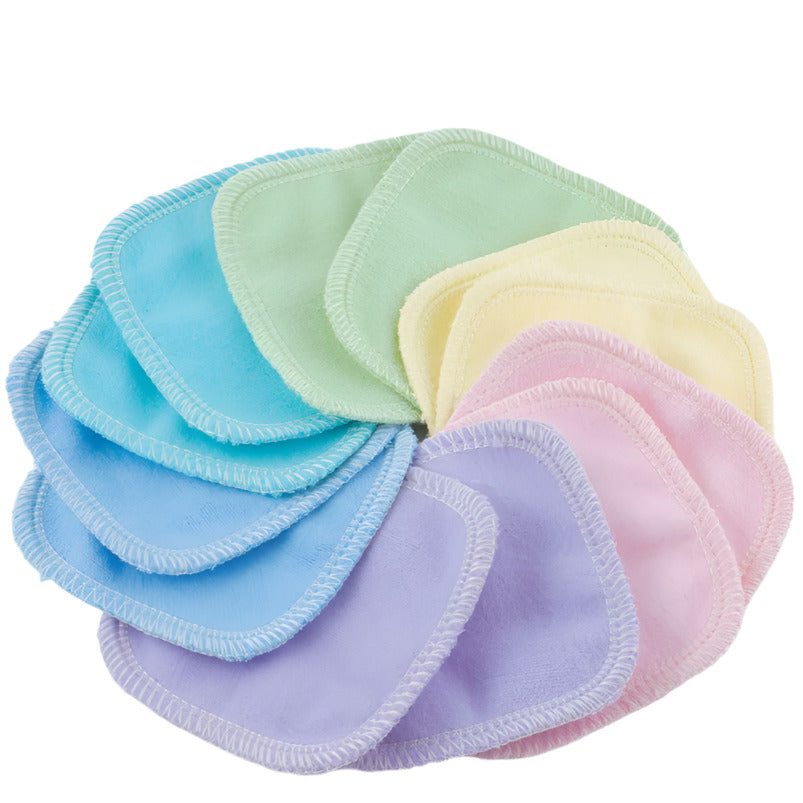 Close-up of pastel-colored reusable facial rounds showing soft microfiber texture and neatly layered edges