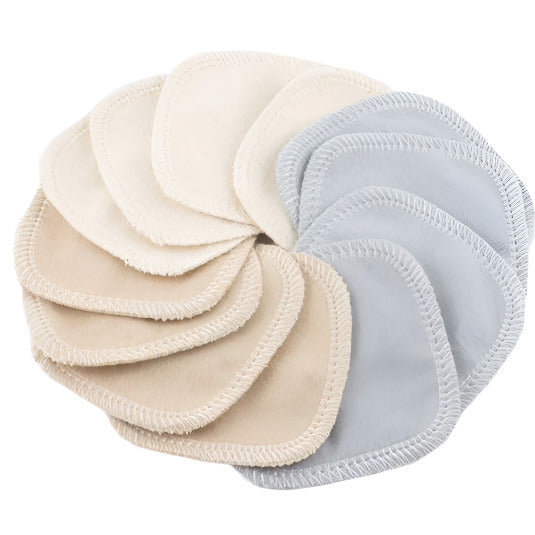 Reusable facial rounds stacked showing soft terry cloth texture and neatly folded edges in pastel teal color