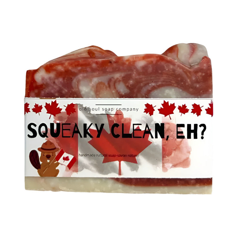 Close-up of the textured, pale green soap bar's embossed logo and smooth surface detail showing gentle indentations