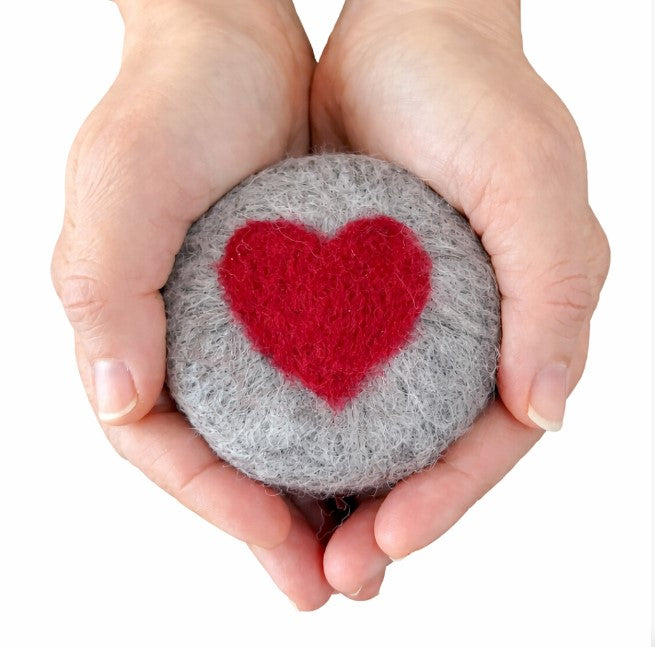 Simply Natural Canada handmade heart felted soap held in hands – natural wool felted exfoliating bar with red heart design