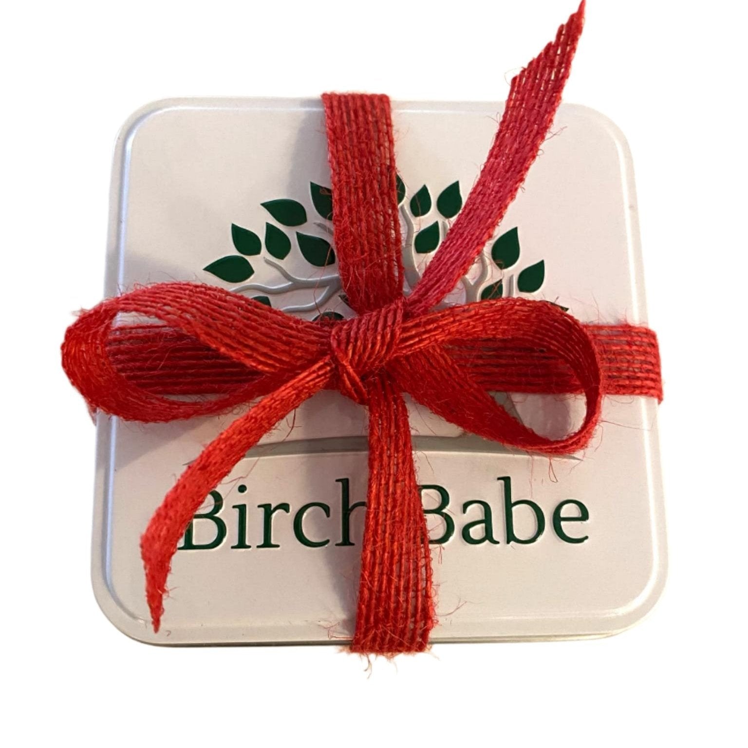 Close-up of Birch Babe Gift Set sampler showing individual product labels and textured packaging details from a top-down