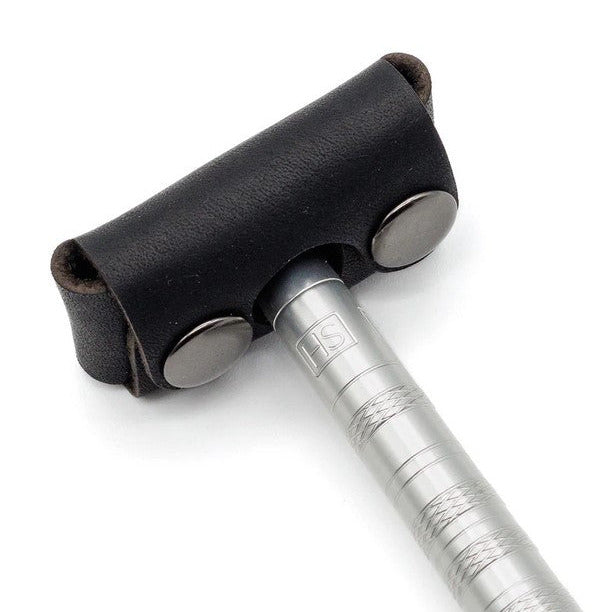 Henson Razor inserted into black leather head cover showing secure snap fastening
