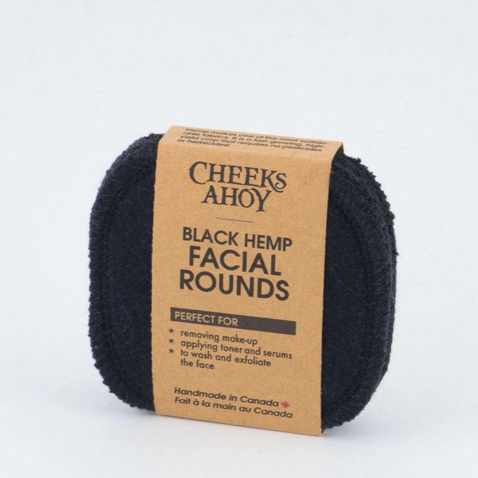 Close-up of textured black hemp bamboo facial rounds stacked, highlighting their soft, absorbent surface and eco-friendly