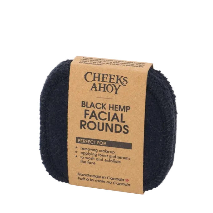 Close-up of black hemp bamboo facial rounds stacked showing textured surface and natural fibers, highlighting eco-friendly