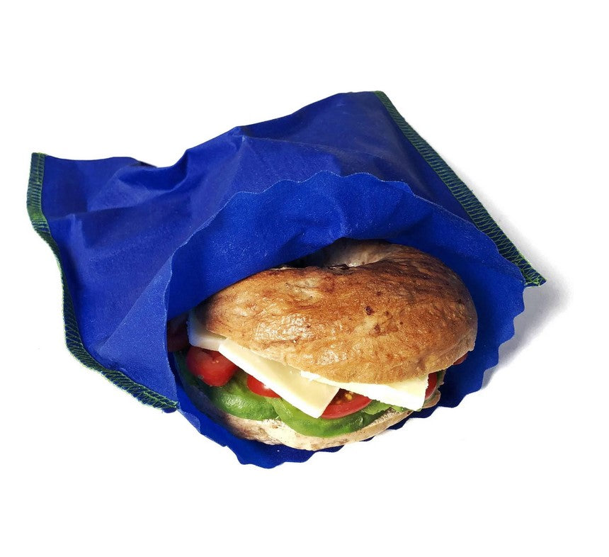 Close-up of colorful beeswax sandwich bags featuring hand-drawn organic farm-inspired patterns and sealed edges for freshness