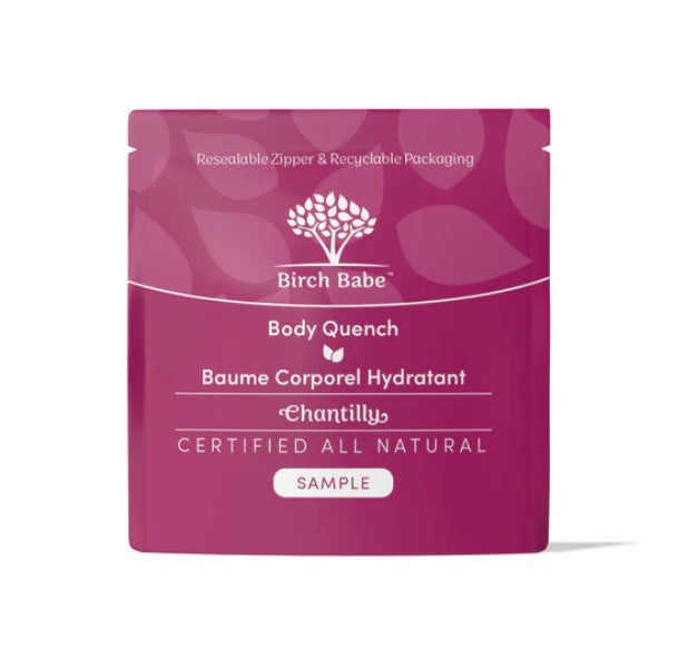 Close-up of the creamy, whipped lotion texture with visible floral scent notes on the Chantilly Body Quench label container.