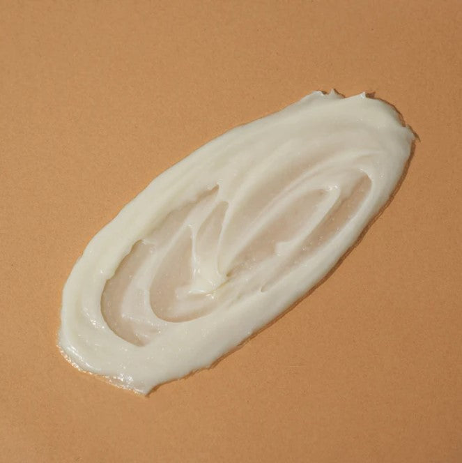 Close-up of Skin Food body lotion tube highlighting handcrafted, organic ingredients and textured label design.