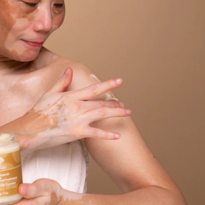 Close-up of the Body Quench bottle’s textured vanilla-scented lotion with a clear pump dispenser and creamy consistency seen