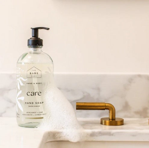 Close-up of the transparent pump dispenser with Bergamot Lime Hand Soap showing bright green liquid and textured surface