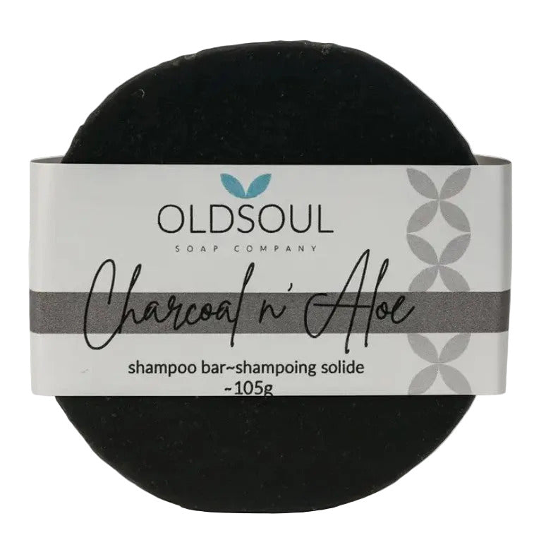 Charcoal and aloe vera shampoo bar with natural texture, highlighting ingredients and eco-friendly packaging by Old Soul