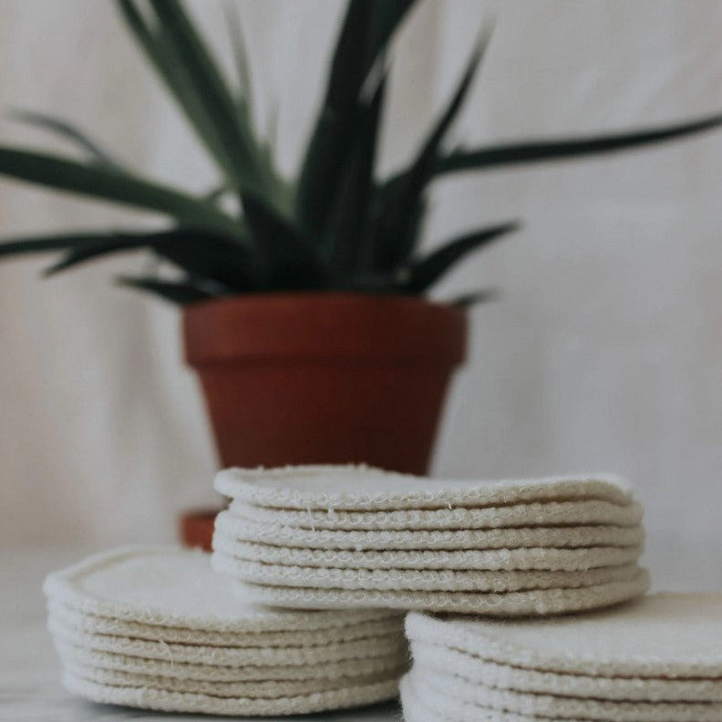 Close-up of hemp bamboo fibers highlighting the textured surface and natural coloration of individual facial rounds for