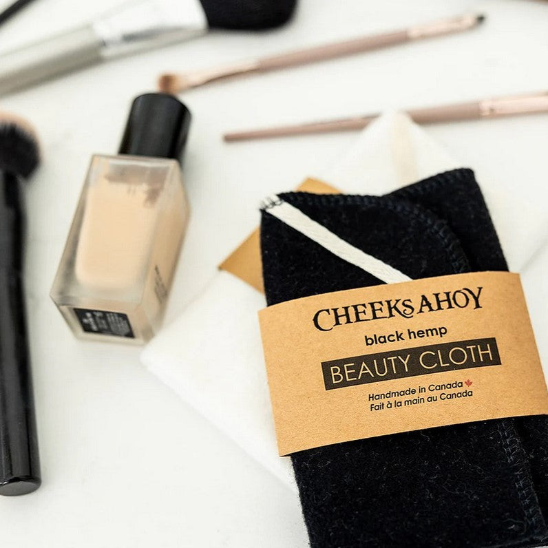 Close-up of the Black Beauty Cloth displaying textured microfiber surface and subtle stitching detail for gentle skin