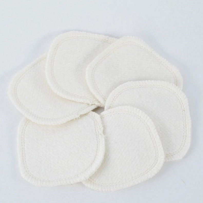 Close-up of textured hemp bamboo facial rounds stacked revealing natural fibers and breathable surface for gentle skin