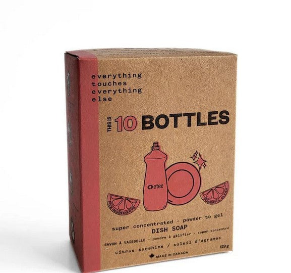 Etee Citrus Powder to Gel Dish Soap Concentrate in clear plastic pouch with orange and yellow labels, textured powder, and