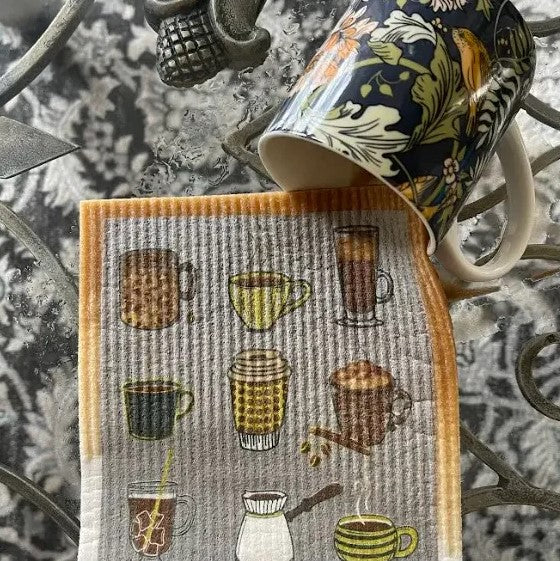 coffee shop Wet-It Swedish dishcloth beside ceramic mug eco friendly reusable sponge cloth coffee lover kitchen cloth plastic free cleaning