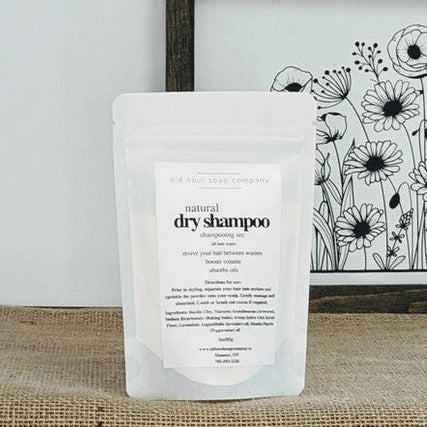 Close-up of natural dry shampoo powder texture showing lightweight, fluffy consistency and subtle herbal scent with visible