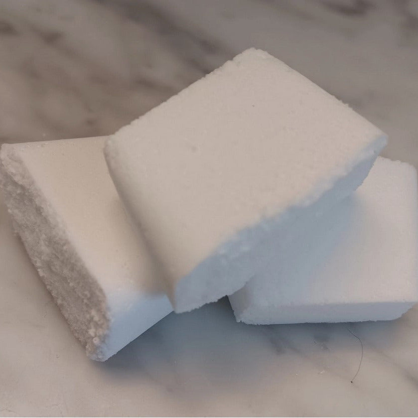 Close-up of Earthly Change Toilet Tablets packaging showing label details and eco-friendly branding