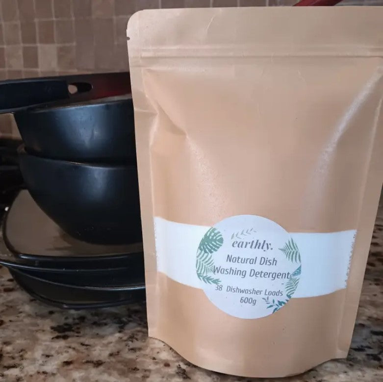 Earthly Change natural dishwasher detergent powder in eco-friendly packaging, made in Canada for zero waste kitchen use