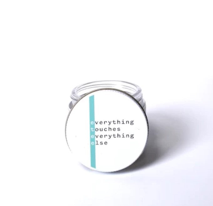 Close-up of daily facial sunscreen tube’s textured pump dispenser and detailed label with ingredient highlights