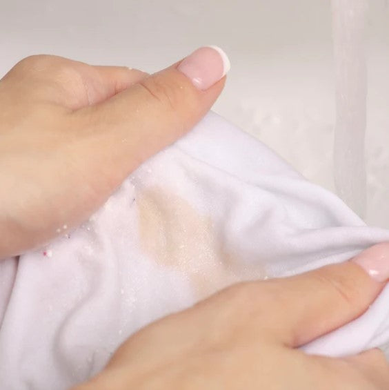 Using CleanO2 Sustain Eraser to treat an old stain on fabric – eco-friendly laundry stain removal bar in action