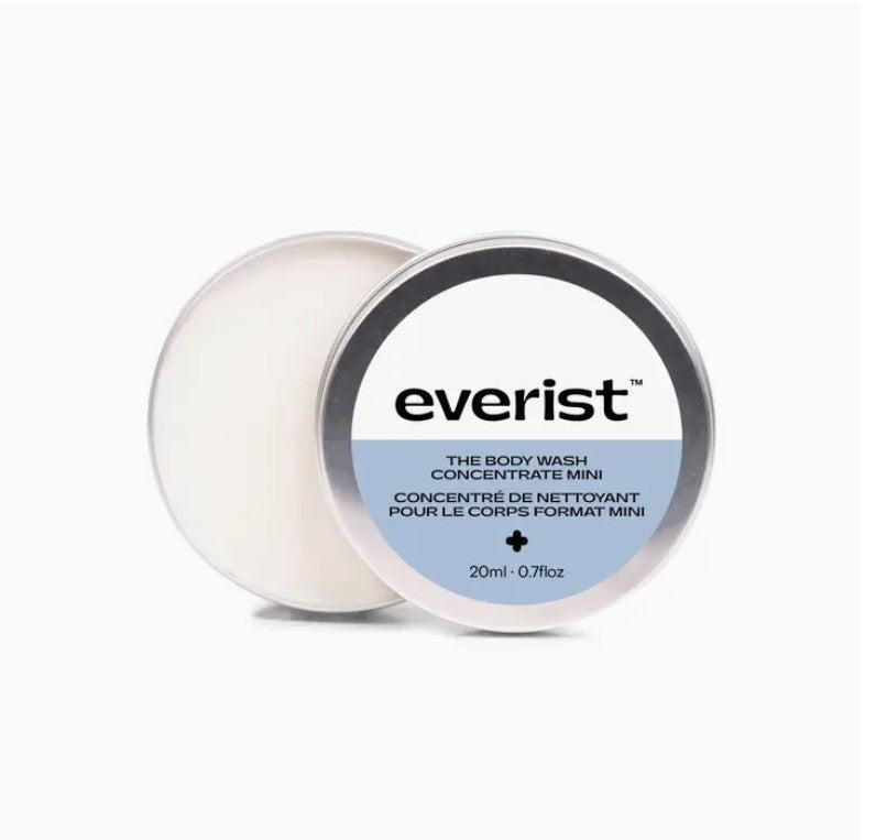 Top-down close-up of the Everist Body Wash Concentrate tin's textured matte silver lid with embossed logo detail