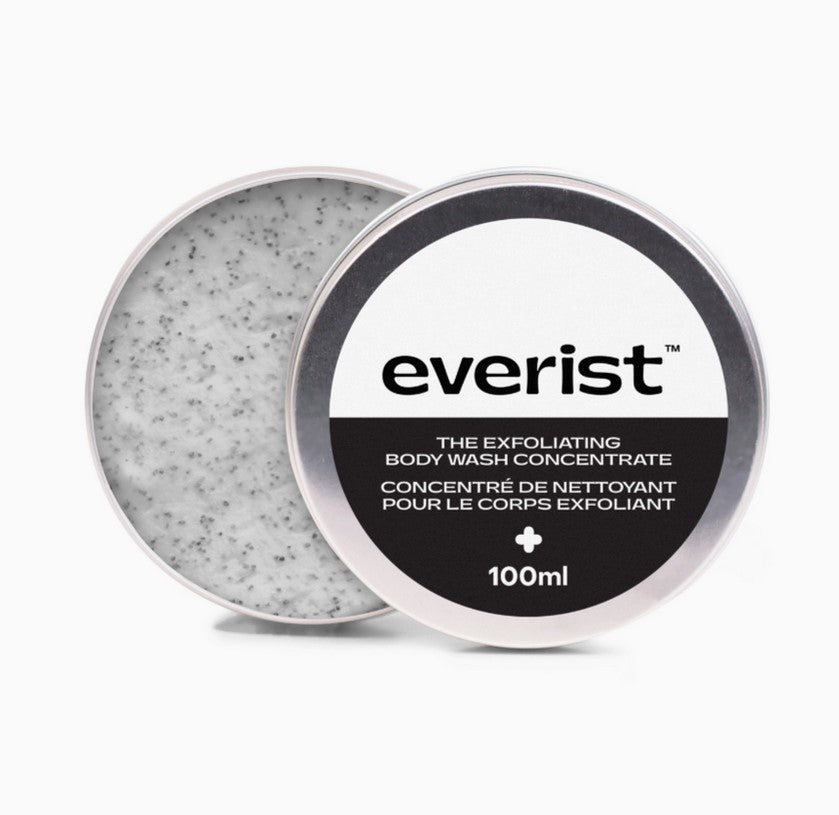 Everist exfoliating body wash concentrate tin featuring textured aluminum surface with black embossed logo and white label