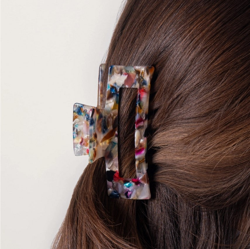 Close-up of the Everist Large Confetti Claw Clip's textured surface featuring vibrant multicolored confetti details on a