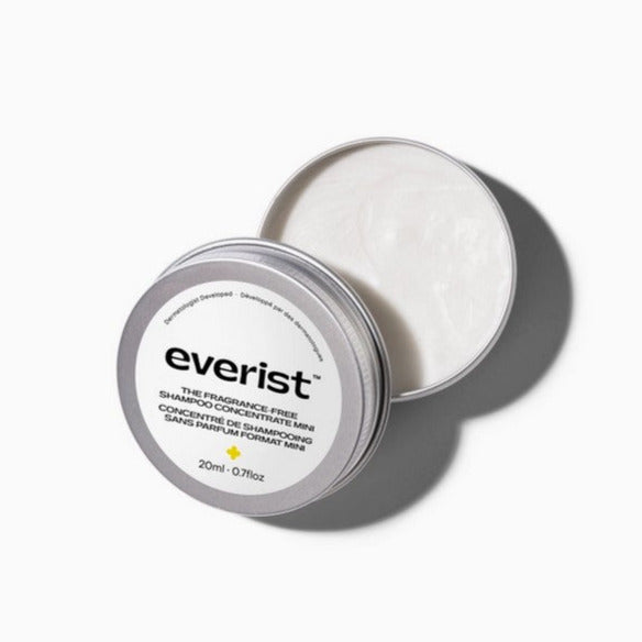 Close-up of Everist Shampoo Concentrate Tin’s textured, fragrance-free surface with subtle branding detail visible