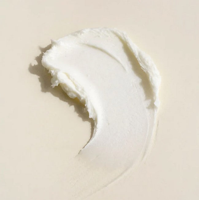 Close-up of Everist Body Wash Concentrate’s textured gel with clear amber hue and visible measuring markings on the