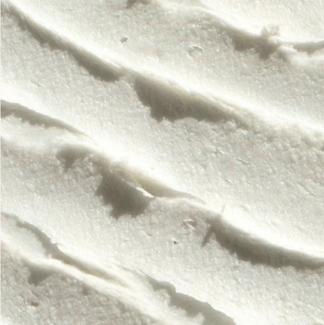 Close-up of Everist Skincare serum bottle label highlighting natural ingredients and calming scent profile