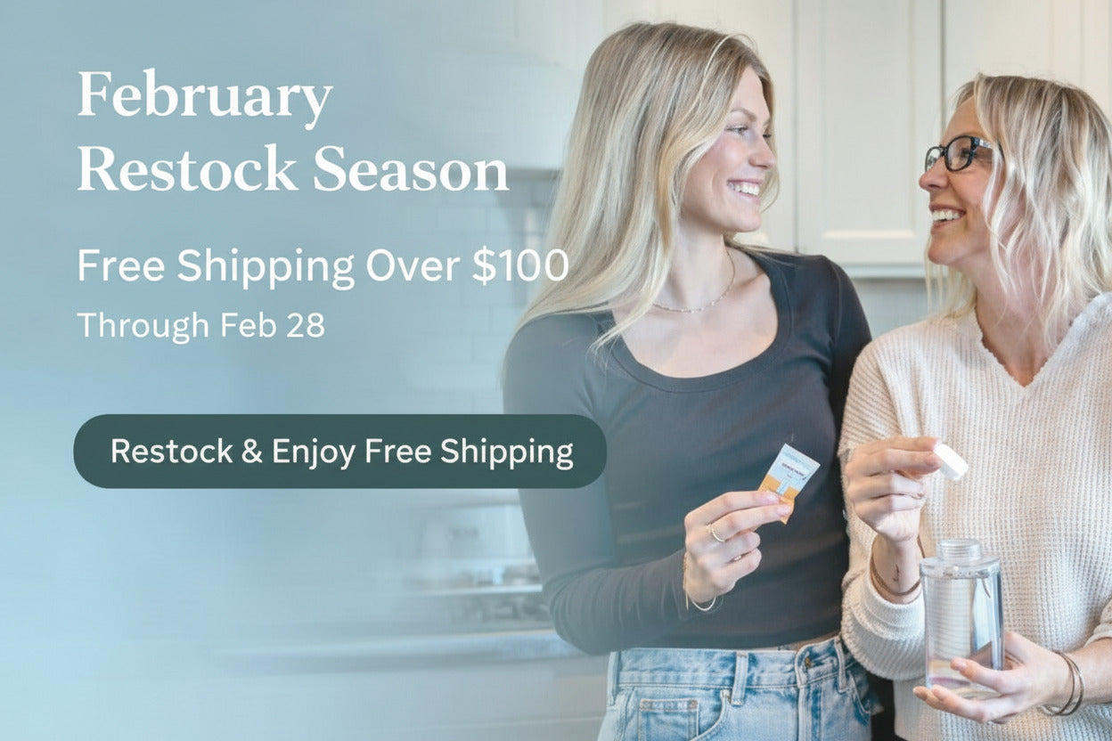 February Restock Season banner featuring two women refilling a glass soap dispenser with Nature Bee dissolvable tablets, promoting free shipping over $100 at Simply Natural Canada