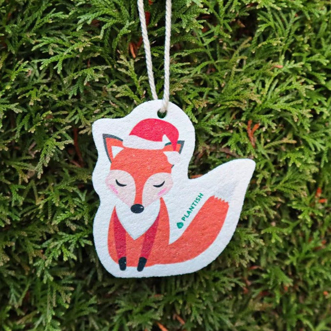 Close-up of the Festive Critter Sponge featuring colorful, textured surface with cheerful holiday patterns from a top-down