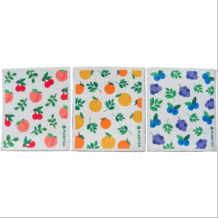 Close-up of the Fruity Cuties Swedish Sponge Cloths displaying vibrant fruit patterns and textured cellulose surface on a