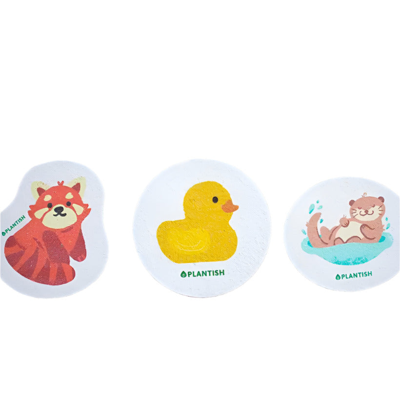 Plantish Furry Friends Pop Up Sponges featuring colorful plush toys: red panda, sleepy otter, yellow ducky, with soft
