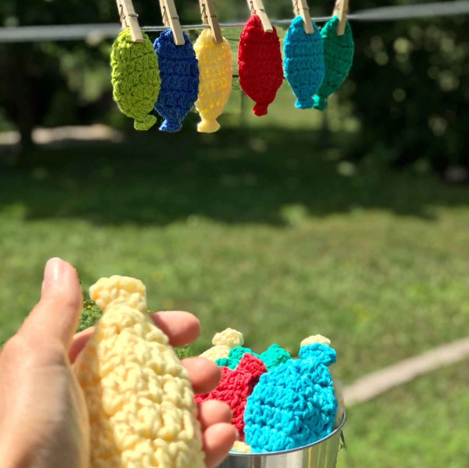 Handmade by Elizabeth crocheted water balloons in pastel blue and pink yarn, soft textured, small 4-inch diameter for babies
