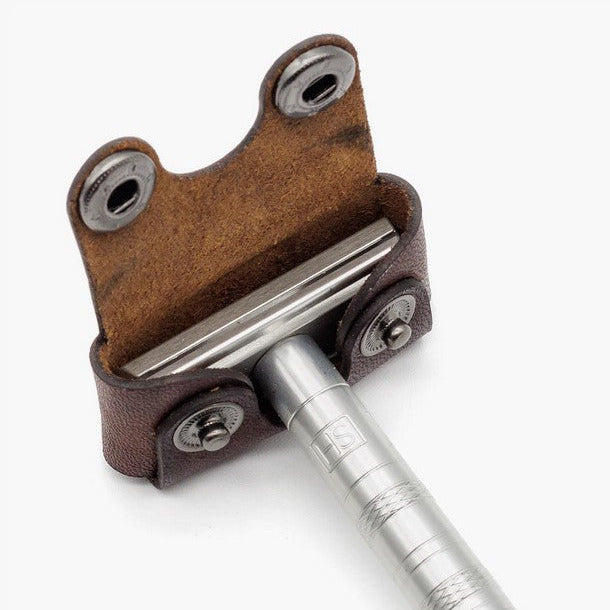 Henson Razor inserted into brown leather head cover showing secure snaps