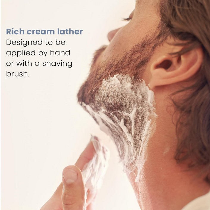 Close-up of Henson Shave Cream tube displaying detailed ingredient list and textured surface, highlighting its smooth, rich