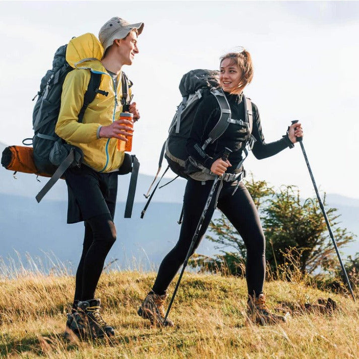 couple hiking outdoors using natural mosquito repellent stickers for adults Canada