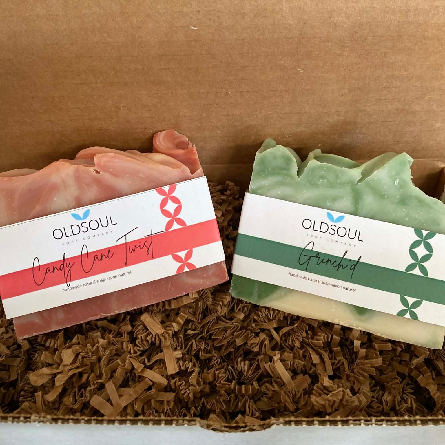 Holiday Soap Gift Box with four seasonal bar soaps in textured paper wrapping, featuring autumnal and winter-themed colors