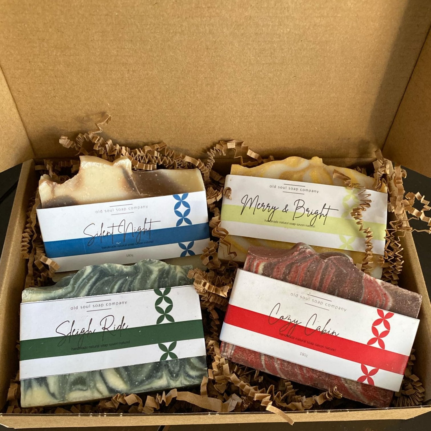 Old Soul Soap Company holiday gift box with four colorful, textured handmade bar soaps featuring festive scents and natural