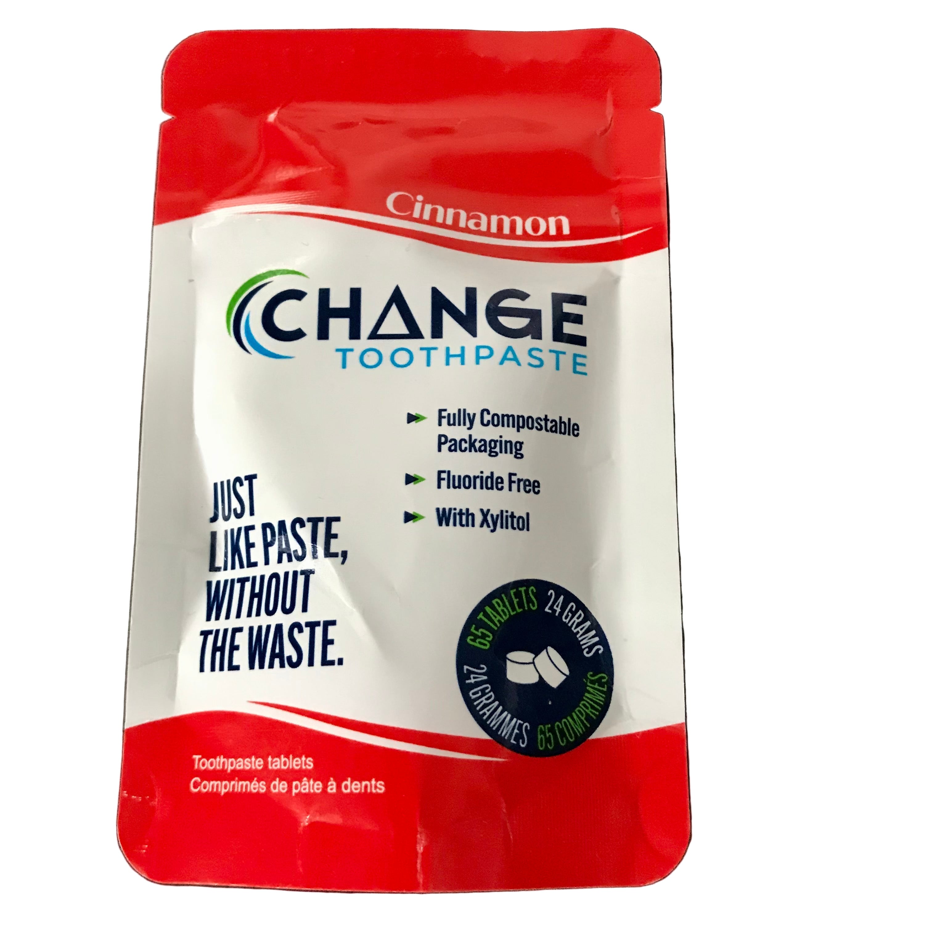 Close-up of cinnamon-flavored toothpaste tablet container's textured surface and distinctive label detail from an angled