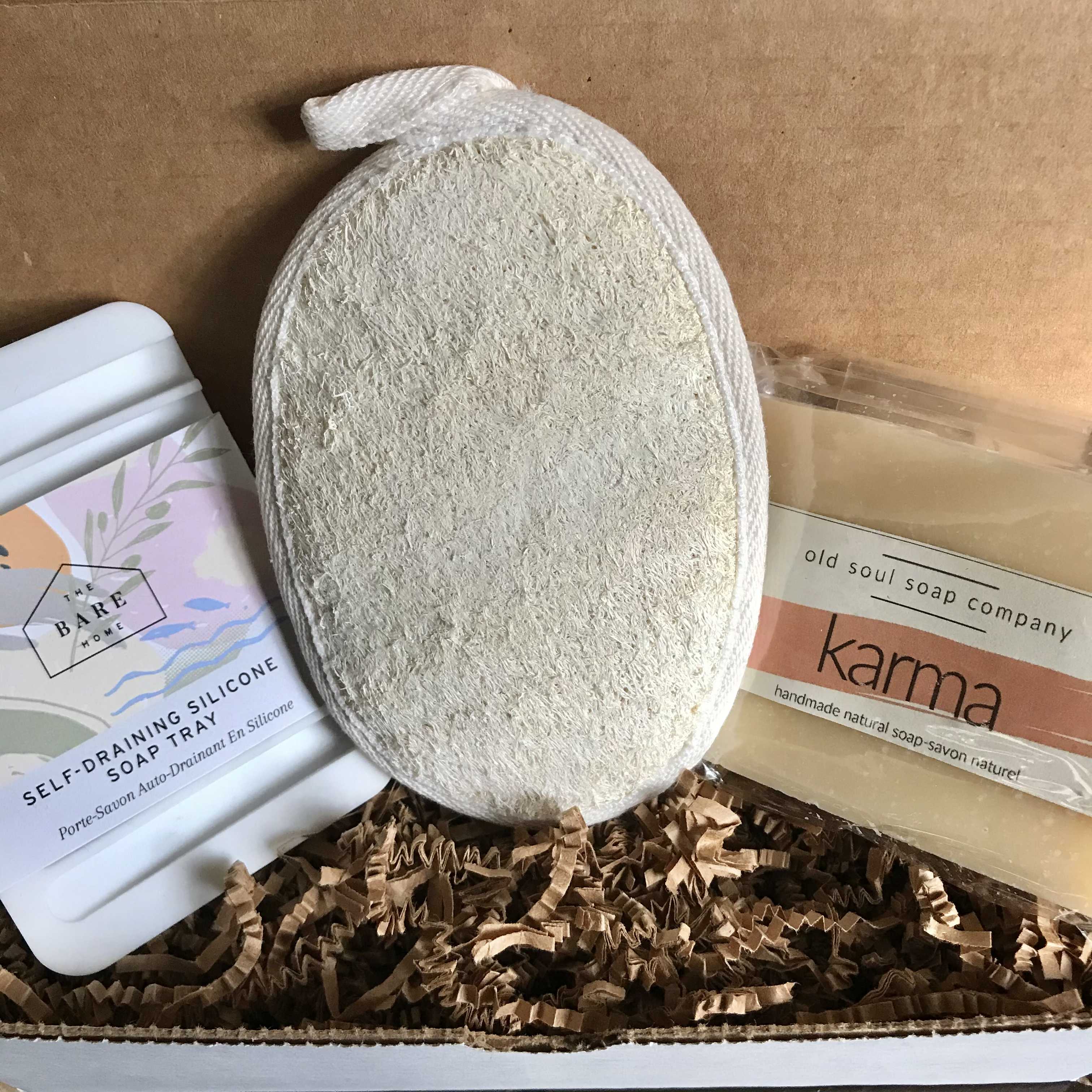 Karma Gift Set featuring vegan bath and shower products in recyclable packaging with natural, earthy-toned bottles and