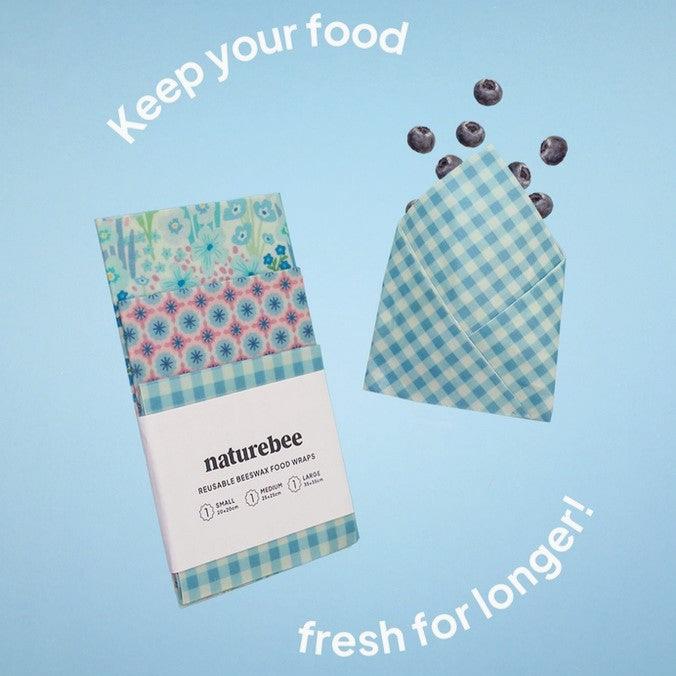 Close-up of the Blue Beeswax Wrap's textured surface with visible organic cotton and beeswax details, showing flexibility