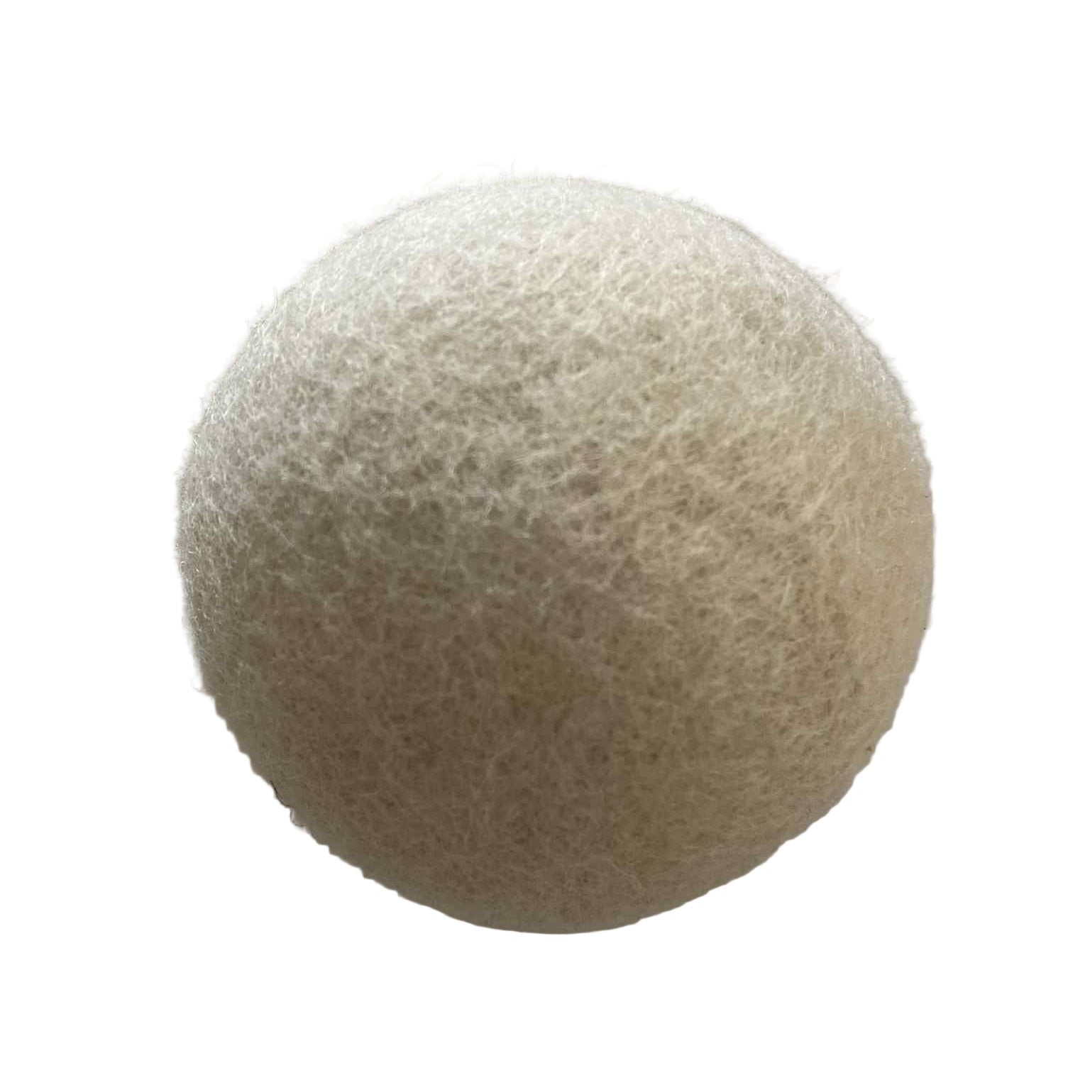 Close-up of Earthly Wool Dryer Balls showing textured, fibrous surface and natural tan color from a bottom corner angle.