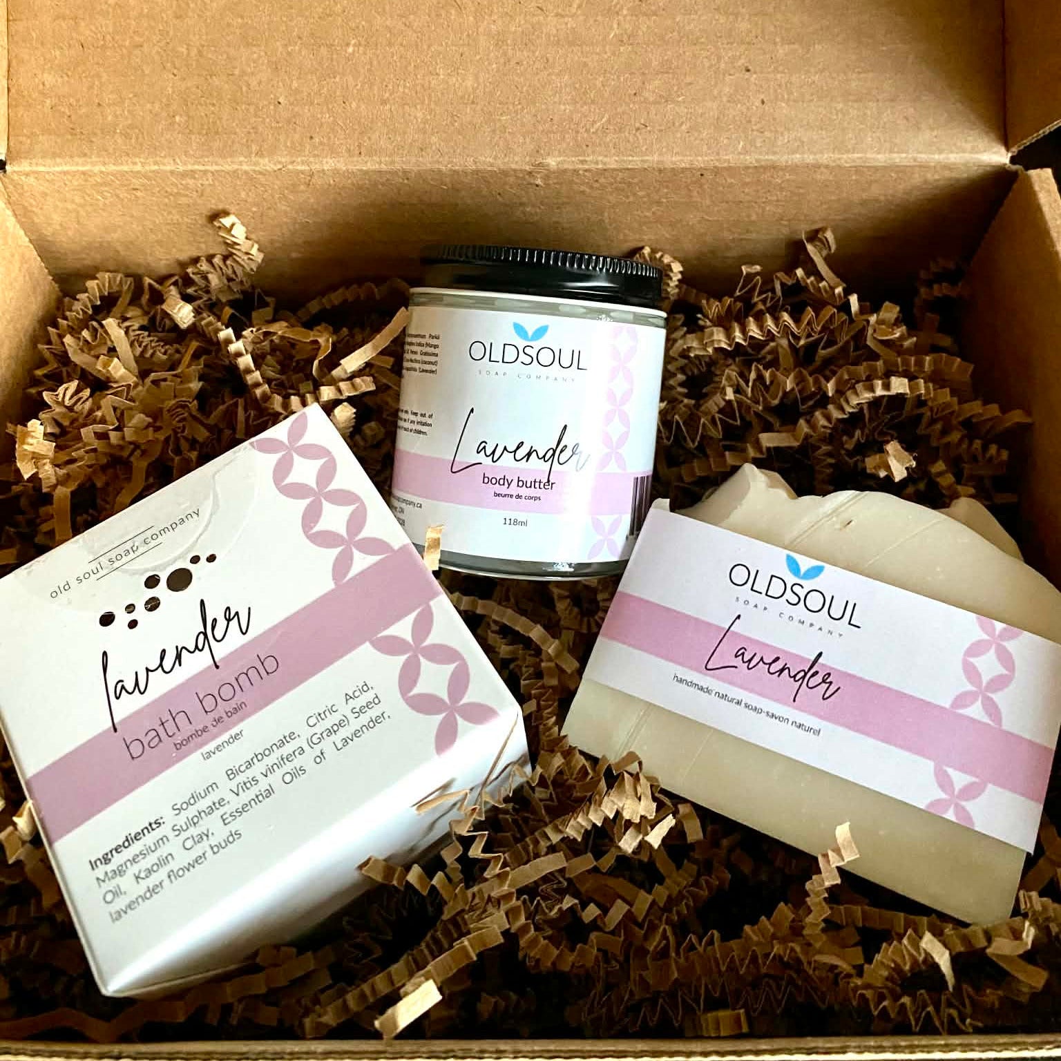 Lavender Gift Set Deluxe featuring Old Soul Soap Company lavender bath bomb, body butter, and artisan soap arranged in eco-friendly gift box packaging