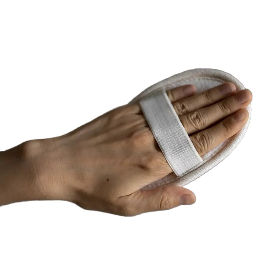 Close-up of the textured loofah’s natural cellulose fibers and vibrant green color, highlighting its soft, exfoliating