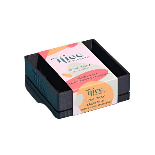 Close-up of the Make Nice Company Dish Soap Tray’s textured, matte ceramic surface with drainage holes and rounded edges.