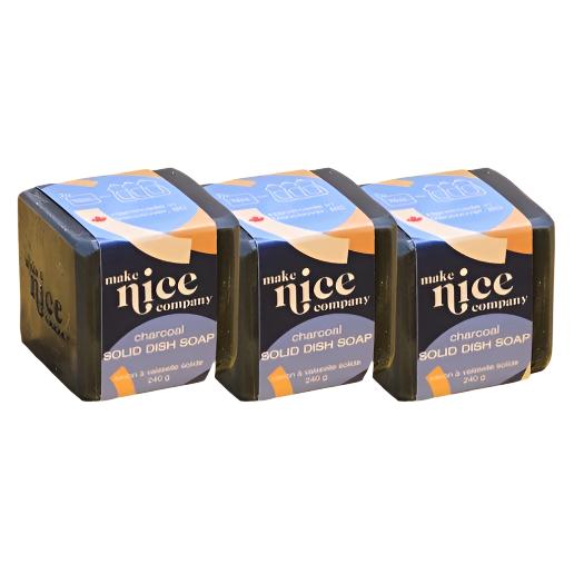 Close-up of the charcoal solid dish soap bar displaying rough textured surface and embedded charcoal particles