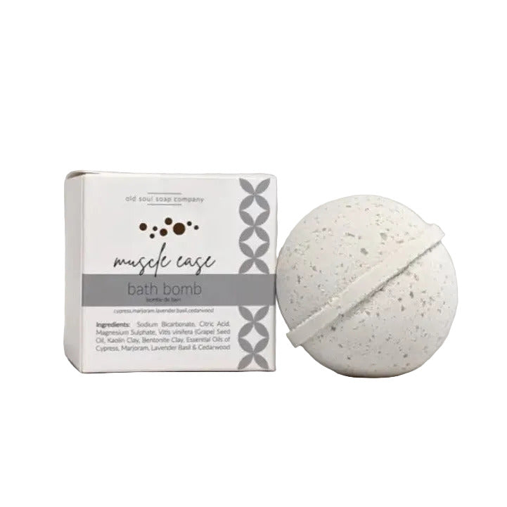 Old Soul Soap Company Muscle Ease Bath Bomb, round unwrapped bedside the box on a white background.